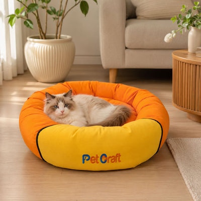 Yükseltilmiş çevre kenarlarına ve dolgulu tabana sahip 50×50 cm Pet Craft simit kedi köpek yatağı